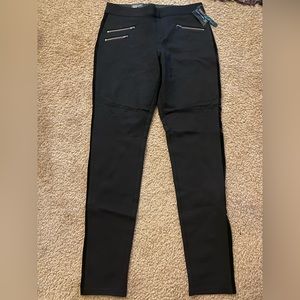 INC pull on black skinny pants with zipper decals in front, back pockets. NWT